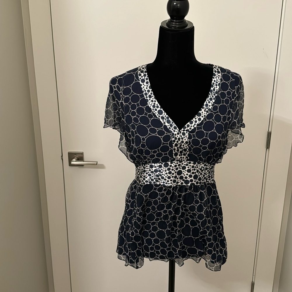Silk top with polyester lining. Navy with white. size large